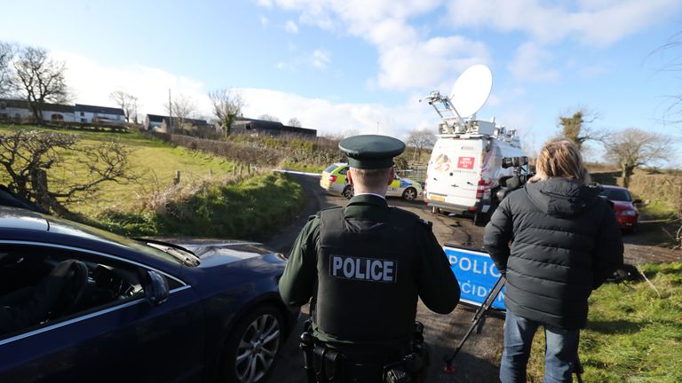 Police set up a checkpoint near the property