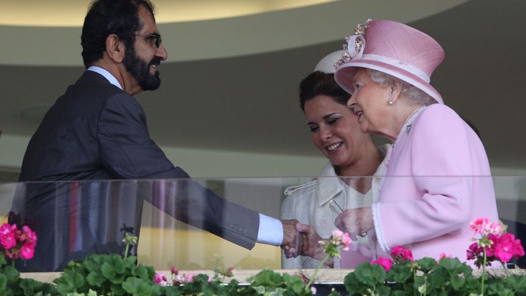 Britain's Queen Elizabeth II (R) greets Sheikh Mohammed and Princess Haya in 2016