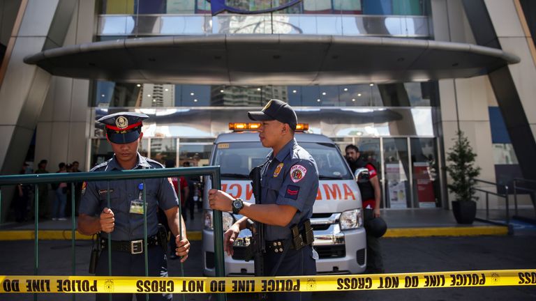 The area around the Greenhills shopping centre in Manila has been sealed off by police