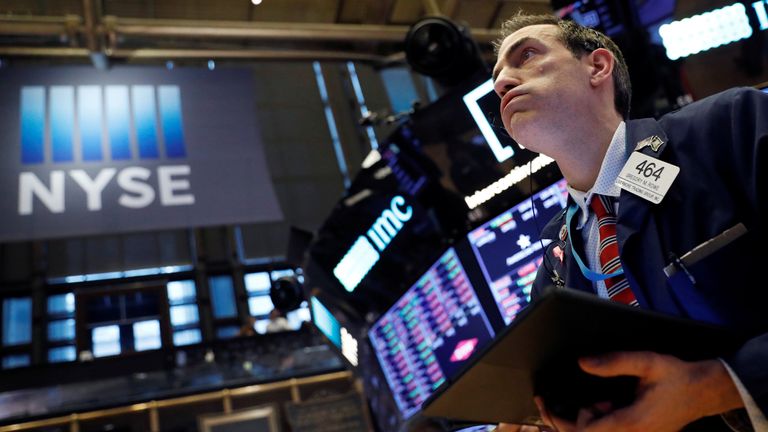 A trader works on the floor at the New York Stock Exchange (NYSE) in New York City, U.S., March 5, 2020