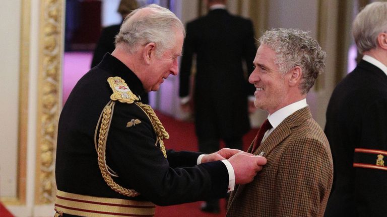 Gordon Buchanan from Glasgow is made an MBE (Member of the Order of the British Empire) by the Prince of Wales during an investiture ceremony at Buckingham Palace, London. PA Photo. Picture date: Thursday March 12 2020. Photo credit should read: Yui Mok/PA Wire