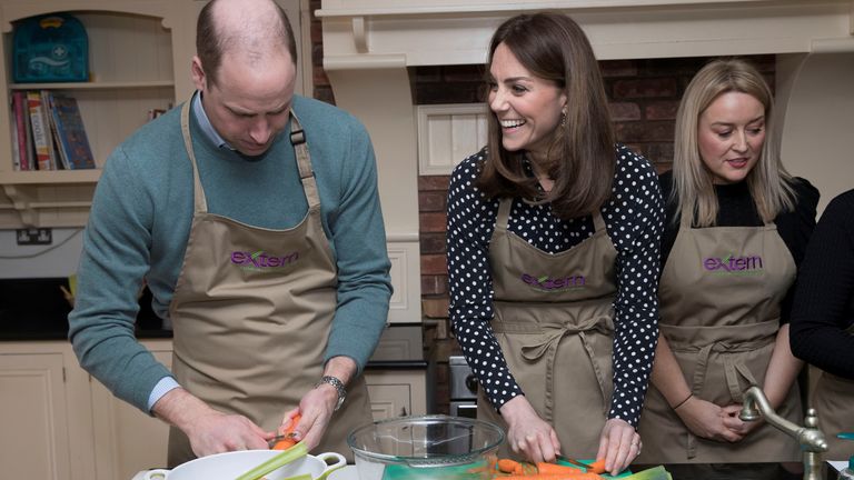 The couple helped prepare a meal in the kitchen at Savannah House, a social justice charity