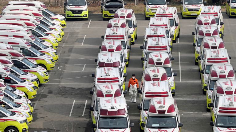 Ambulances wait to transport infected patients from Daegu, South Korea