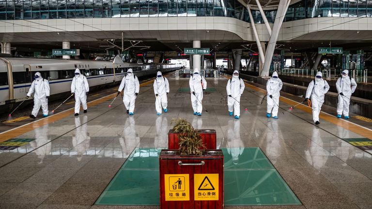 Wuhan Railway Station is disinfected on Tuesday as authorities announced the city would re-open on 8 April