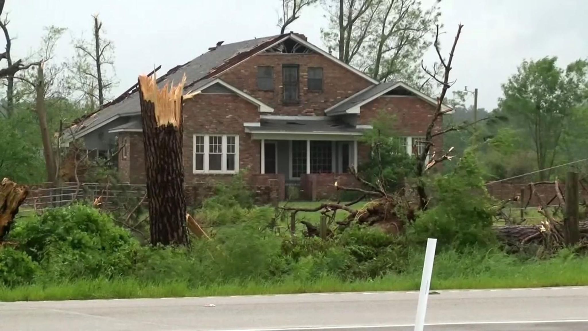 Tornadoes kill at least 30 people and damage hundreds of homes in