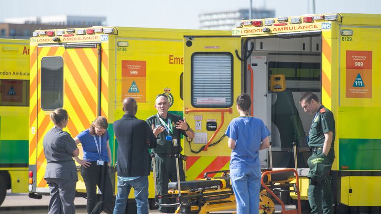 Paramedics and medical staff with waiting ambulances outside the NHS Nightingale Hospital at the ExCel centre in London, a temporary hospital with 4000 beds which has been set up for the treatment of Covid-19 patients.