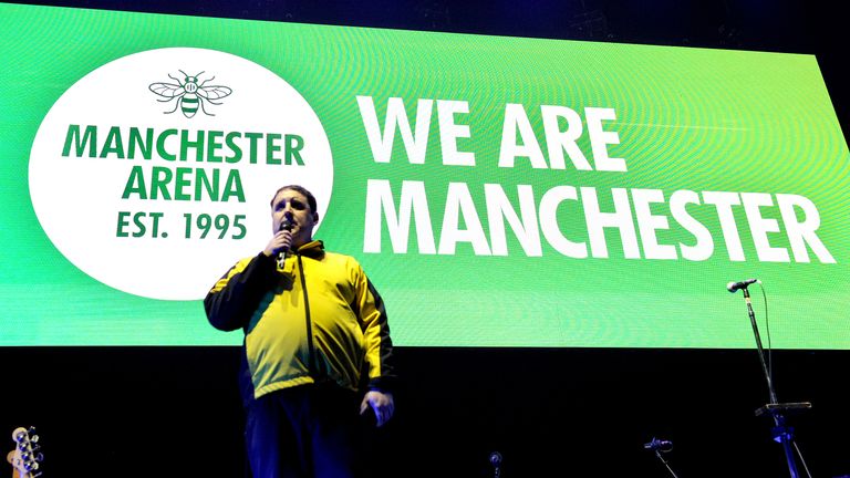 MANCHESTER, ENGLAND - SEPTEMBER 09: Peter Kay wears a Shosec security staff jacket while giving a speech on the terror attacks and introducing headliner Noel Gallagher during the 'We Are Manchester' benefit concert at Manchester Arena on September 9, 2017 in Manchester, England. Manchester Arena officially reopens following the terror attack on May 22nd. The concert will support the Manchester Memorial Fund. (Photo by Shirlaine Forrest/Getty Images)