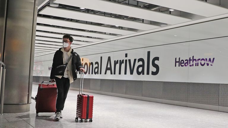 Passengers arrive at Heathrow Airport in London after the last British Airways flight from China touched down in the UK following an announcement that the airline was suspending all flights to and from mainland China with immediate effect amid the escalating coronavirus crisis.