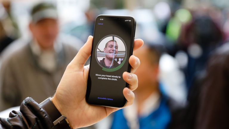A customer sets up Face ID on his new iPhone X at the Apple Store Union Square on November 3, 2017, in San Francisco, California. Apple&#39;s flagship iPhone X hits stores around the world as the company predicts bumper sales despite the handset&#39;s eye-watering price tag, and celebrates a surge in profits. / AFP PHOTO / Elijah Nouvelage (Photo credit should read ELIJAH NOUVELAGE/AFP via Getty Images)
