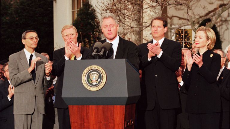 President Bill Clinton reacts to being impeached by the House of Representatives in December 1998
