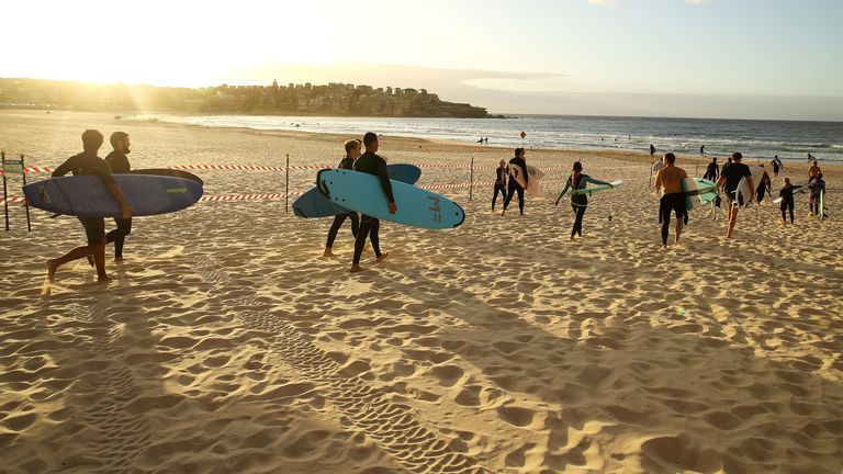 Surfers head to the beach as the lockdown is eased