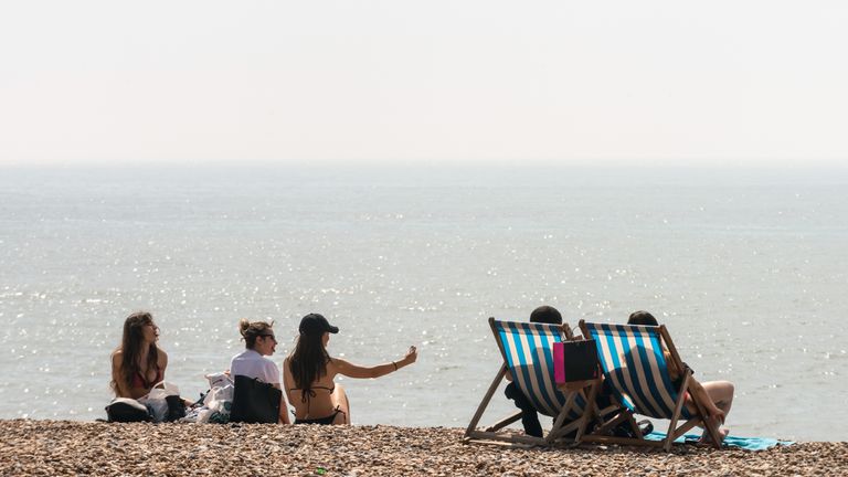 BRIGHTON, ENGLAND - APRIL 22 2019, a year before the Easter Lockdown: People enjoy the beach during the warm weather on Bank Holiday Easter Monday on April 22, 2019 in Brighton, England. This Easter weekend has broken previous hot weather records with the warm weather expected to continue into next week. (Photo by Andrew Hasson/Getty Images)