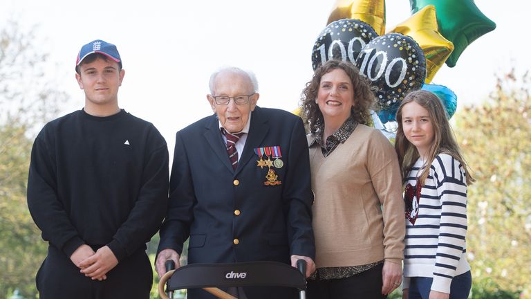 Cpt Tom Moore, with (left to right) grandson Benji, daughter Hannah Ingram-Moore and granddaughter Georgia