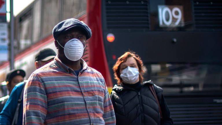 People pictured wearing face masks in Brixton, south London