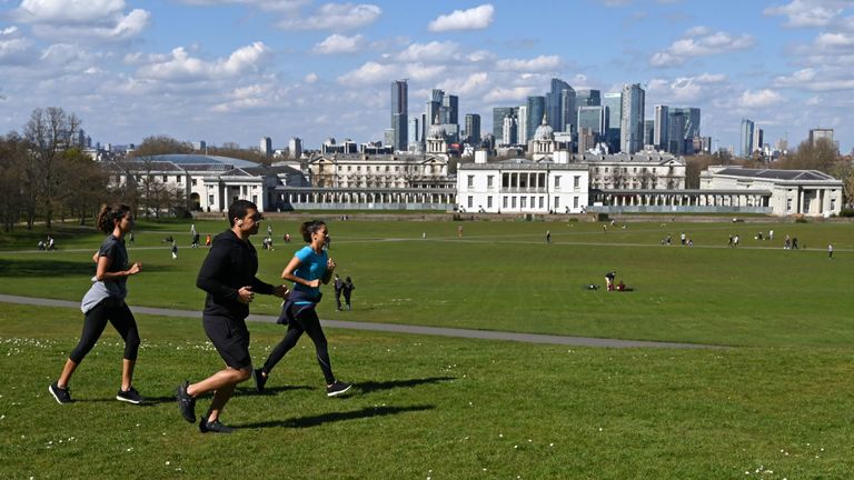 People take their exercise in Greenwich Park in south London