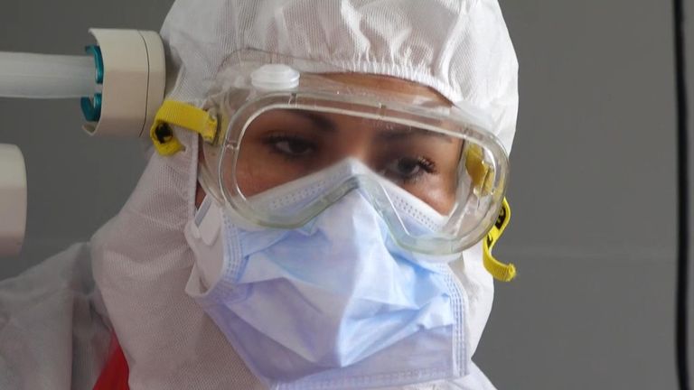 All medical staff are dressed in protective gowns, masks and goggles