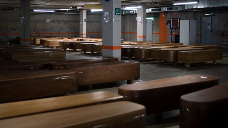 Coffins carrying the bodies of people who died of coronavirus in a car park at a funeral home in Barcelona