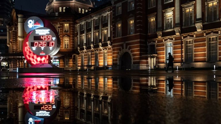 A clock is still counting down to the Olympics outside Tokyo Railway station