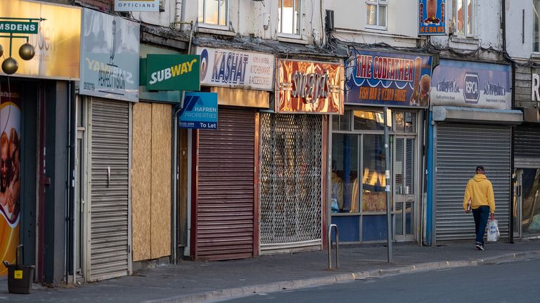 CARDIFF, UNITED KINGDOM - APRIL 21: Closed shops on Cowbridge Road East during the coronavirus lockdown period on April 21, 2020 in Cardiff, United Kingdom.The British government has extended the lockdown restrictions first introduced on March 23 that are meant to slow the spread of COVID-19. (Photo by Matthew Horwood/Getty Images)