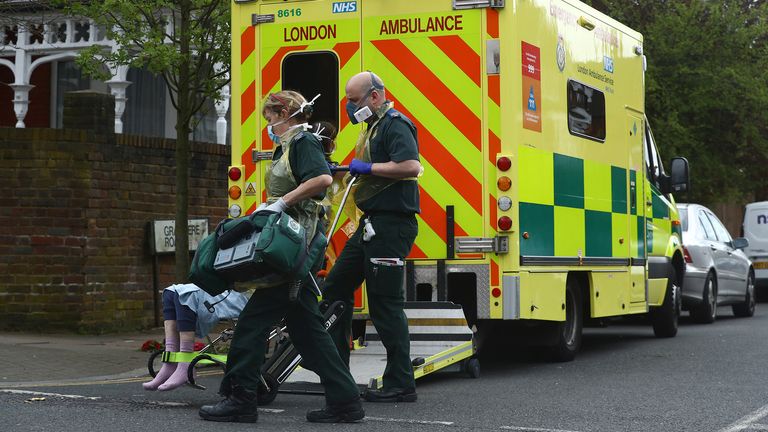  Medical workers with a patient in Streatham, as the spread of the coronavirus disease (COVID-19) continues, London, Britain, April 2, 2020. REUTERS/Hannah McKay