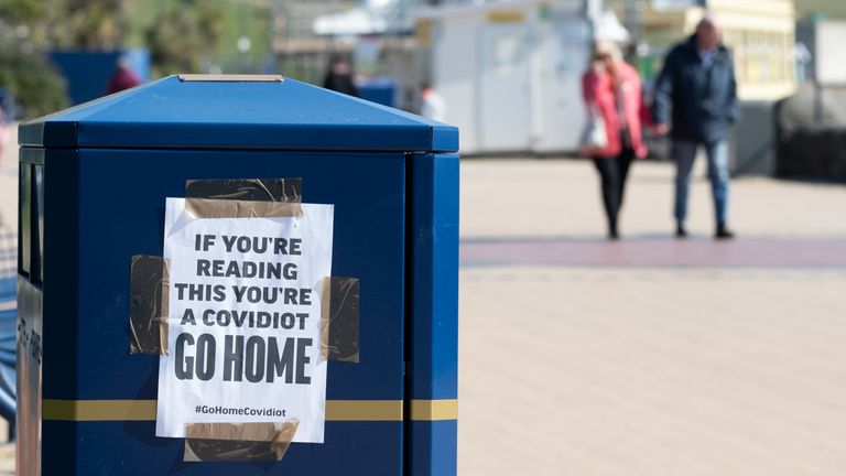 A sign warning visitors to “Go Home” at Barry Island on March 25, 2020 in Barry, United Kingdom. The Coronavirus (COVID-19) pandemic has spread to at least 182 countries, claiming over 18,000 lives and infecting hundreds of thousands more