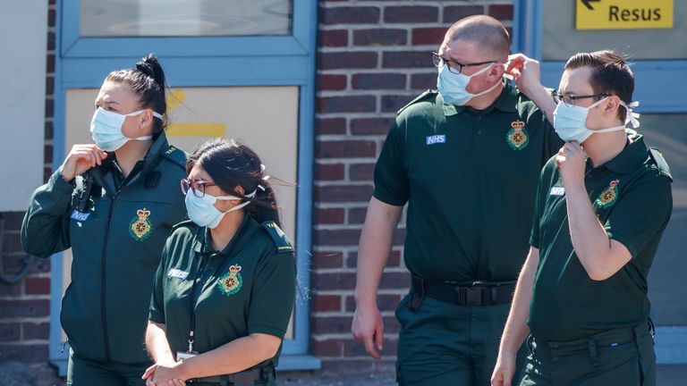 Ambulance crew members wear face masks outside Doncaster Royal Infirmary