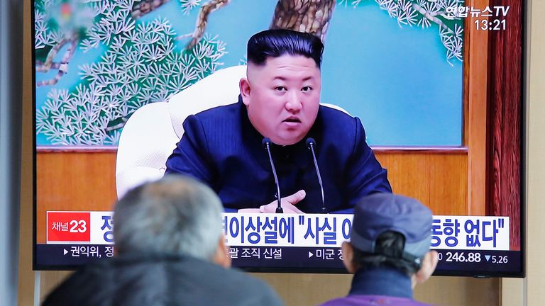 South Korean people watch a TV broadcasting a news report on North Korean leader Kim Jong Un in Seoul, South Korea, April 21, 2020. REUTERS/Heo Ran