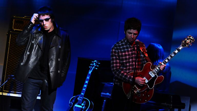 Noel and Liam Gallagher perform together in one of their final shows before Oasis split in 2009