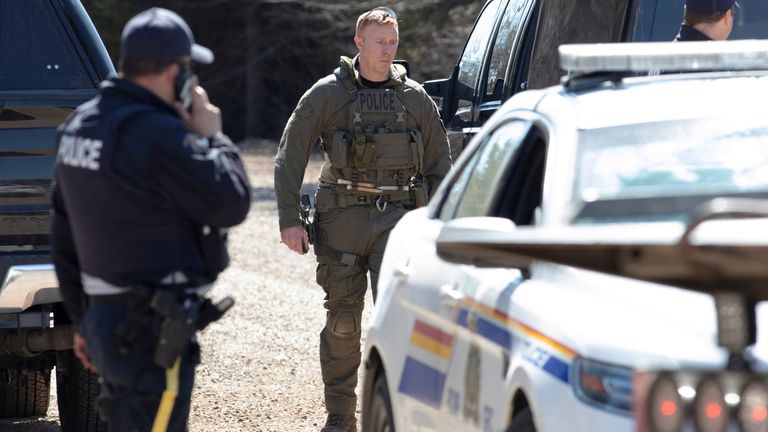 RCMP officers stand on Portapique Beach Road after Gabriel Wortman, a suspected shooter, was taken into custody and was later reported deceased according to local media, in Portapique, Nova Scotia, Canada April 19, 2020