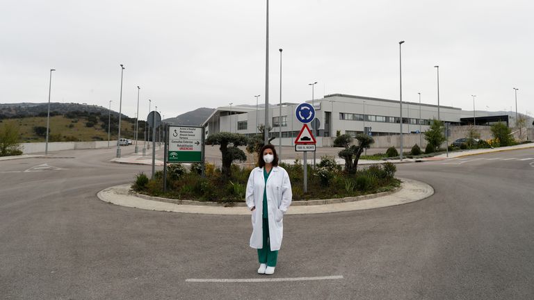 Maria Jose Garcia, an intensive care unit nurse, poses outside her workplace, a hospital, amid the coronavirus...