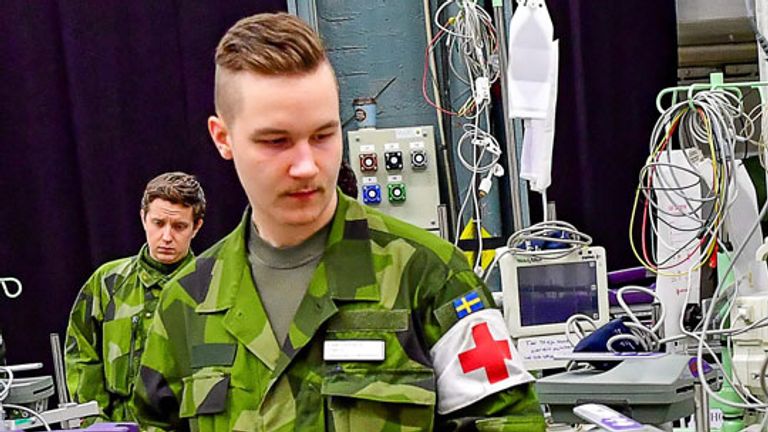  Swedish Army personal and civilian construction workers have been helping to prepare  a field hospital in the Stockholm International Fairs facility