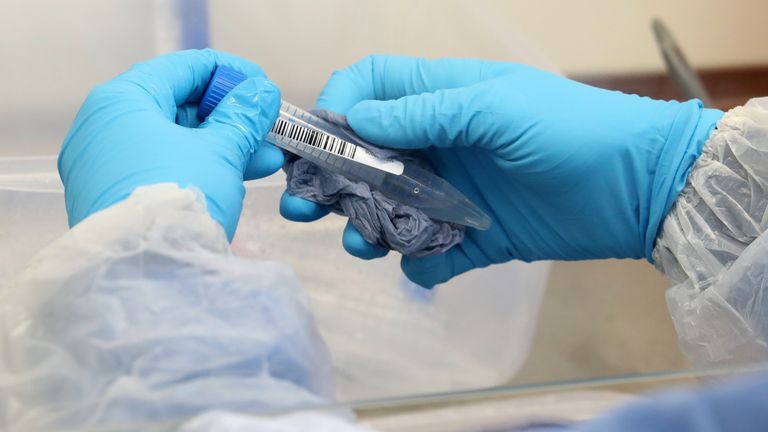 A test tube is cleaned on arrival at the new Covid-19 testing lab at Queen Elizabeth University Hospital, Glasgow.