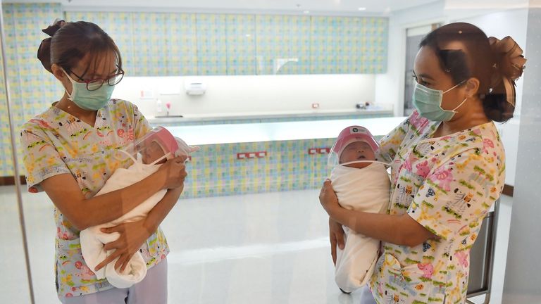 New born baby wearing a tiny face shield in Bangkok - Anadolu Ajansı