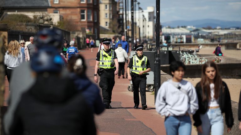 Police officers patrol the beach front at Portobello as the UK continues in lockdown to help curb the spread of the coronavirus.