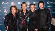 Robbie Williams and Take That will reunite for the online gig on Friday. File pic