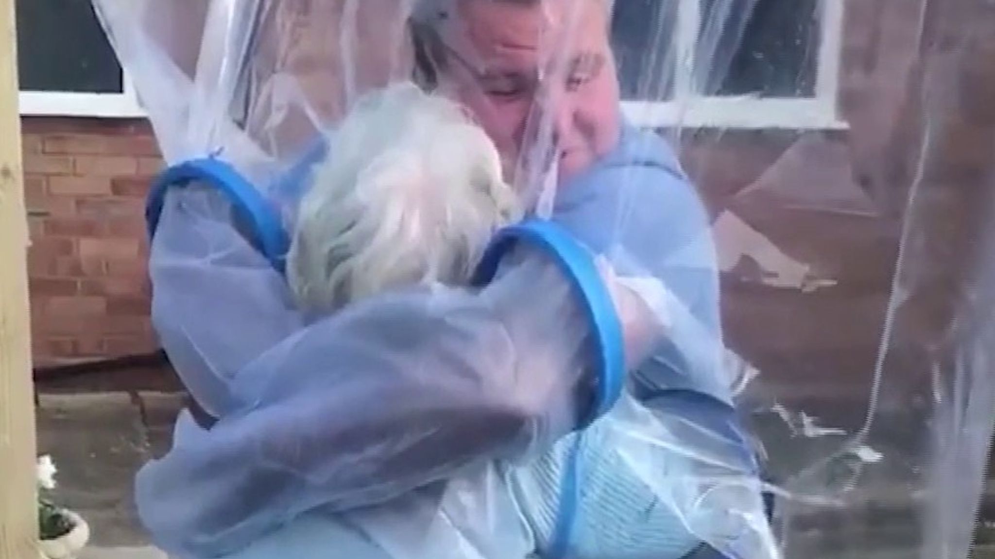 Coronavirus: Family finds way to hug during lockdown | UK News | Sky News