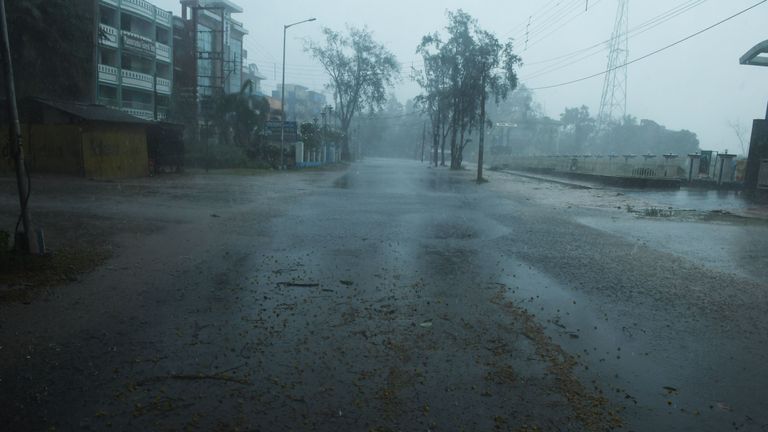 A deserted road is seen ahead of the expected landfall of cyclone Amphan in Digha, West Bengal, on May 20, 2020. - India and Bangladesh began evacuating more than two million people on May 18 as a cyclone barrelled towards their coasts, with officials racing to ready extra shelters amid fears of coronavirus contagion in cramped refuges. (Photo by Dibyangshu SARKAR / AFP) (Photo by DIBYANGSHU SARKAR/AFP via Getty Images)