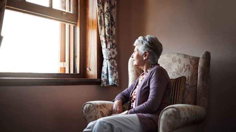 Shot of a senior woman sitting alone in her living room