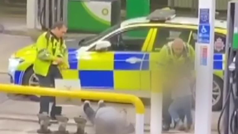 Two police officers have been filmed tasering a man in front of a child - he was later charged with motoring offences.