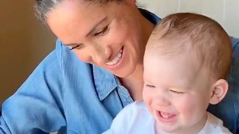 Meghan reads to Archie as he turns one. Pic: Sussex Royal