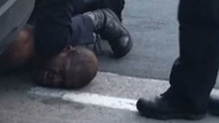 The man could be heard saying he couldn't breathe as he was pinned to the ground