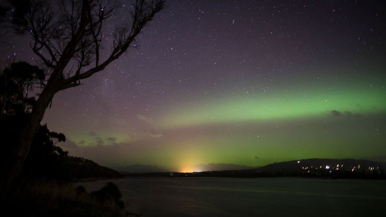 The Aurora Australis, or "Southern Lights" light up over the Mersey River in Devonport on March 27, 2017 in Devonport, Australia. Aurora Australis, also known as the Southern Lights, happens when the sun releases a massive burst of solar wind and magnetic fields into space. These solar winds carry particles which interact with earth&#39;s magnetic field, colliding to produce energy releases in the form of auroras. (Photo by Heath Holden/Getty Images)
