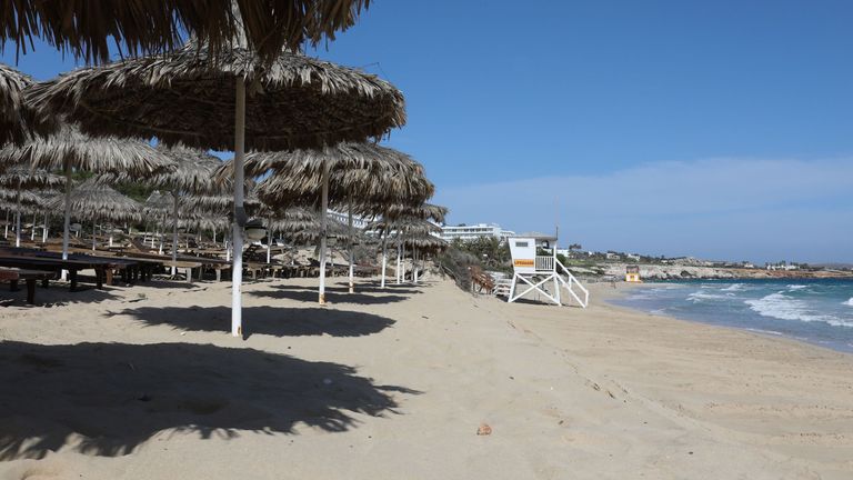 A deserted beach is pictured in the Cypriot resort town of Ayia Napa on May 4, 2020, as the island country gradually eases its lockdown restrictions placed for the COVID-19 coronavirus pandemic. - Cyprus revealed a plan to gradually ease coronavirus lockdown measures and reboot the Mediterranean holiday island&#39;s economy. The Republic of Cyprus, which controls the southern two-thirds of the divided island, had imposed strict measures soon after its first novel coronavirus cases were confirmed on 
