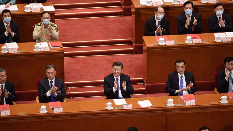 China&#39;s President Xi Jinping (C) applauds after the National People&#39;s Congress approves a proposal to draft a Hong Kong security law