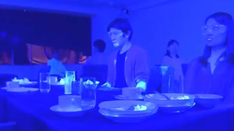 The &#39;virus&#39; had spread to everybody&#39;s plates, glasses and many of their faces. Pic: NHK