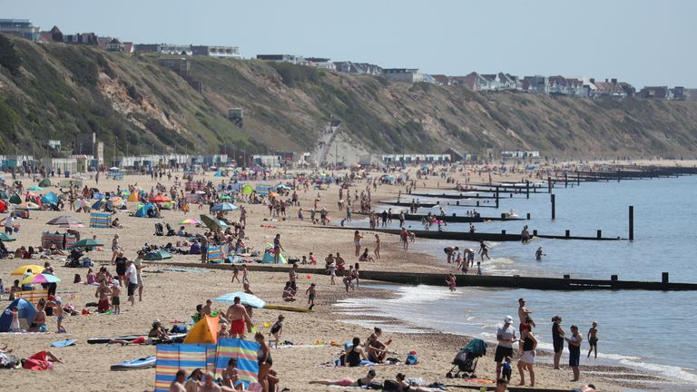 People enjoy the hot weather on Boscombe beach in Dorset, following the introduction of measures to bring the country out of lockdown.