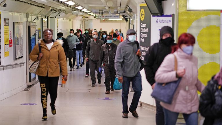 Commuters, some wearing masks are seen at Stratford station, following the outbreak of the coronavirus disease (COVID-19), London, Britain, May 13, 2020. REUTERS/Henry Nicholls