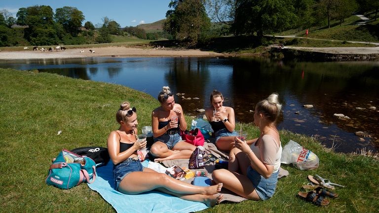 People enjoy the hot weather at Bolton Abbey in North Yorkshire, as people flock to parks and beaches with lockdown measures eased.