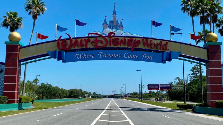 An empty road leads into a deserted Disney resort after it was closed due to the COVID-19 pandemic in Kissimmee, Florida on May 5, 2020.