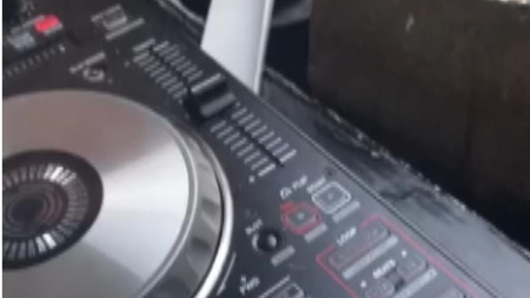 Footage shows DJ decks being used
